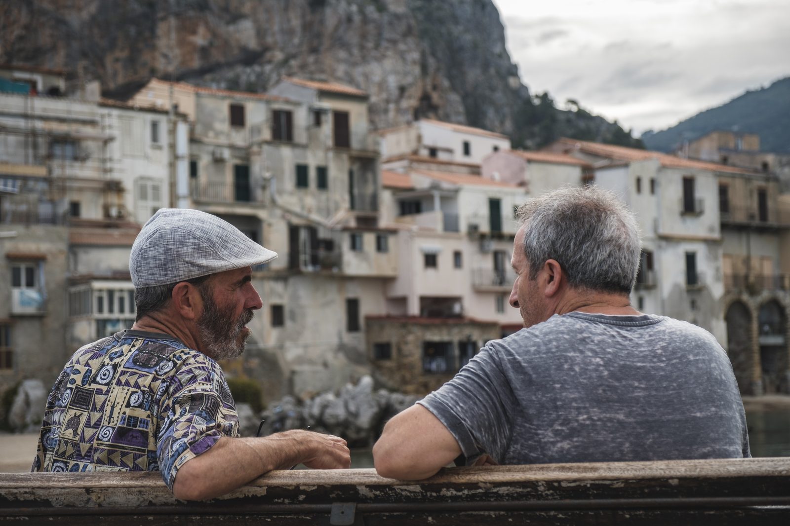 Two old friends talking on a bench