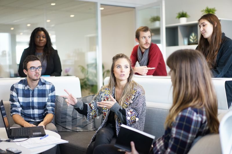 A woman leading a small group discussion